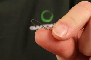 Step 1. Start off by tying a small loop in the end of a length of your chosen monofilament hooklink.