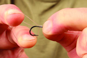 Step 2. Create a loop - it may need to be larger so you can whip it up the hook shank.