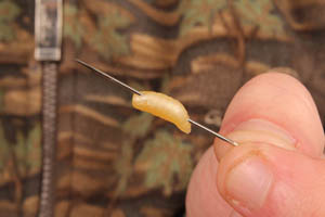 Step 2. Using a sewing needle pierce the rubber grub (orientation as shown)...