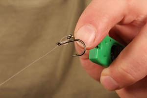 Step 5. The D should look a little like this - small and neat and sitting straight on the back of the shank of the hook.