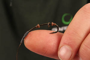 Step 5. Thread on a rig ring and a second hook stop as shown here.