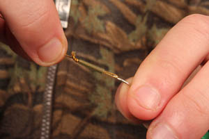 Step 7. For stillwater angling we prefer a short hooklink so cut down tail rubbers so they are not so obtrusive.