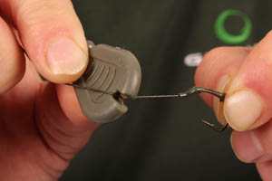 Step 8. Create a hinge at the height you ant to fish the pop up by stripping a small section of hooklink.