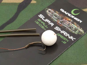 Step 4. Slide a fairly long length of Covert Supa Shrink on to the rig and position as pictured to trap the bait tight to the shank of the hook.