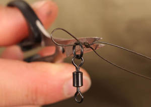 Step 6. Tighten down using both tags from the knot and cut off excess.