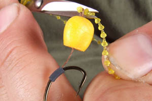 Step 6. Simply add a dumbell hair stop to keep the hookbait in place.