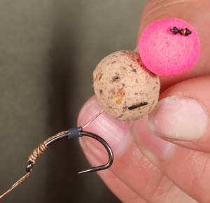Step 3 - Position the Silicone on the bend of the hook and make sure the bait has a small separation from the hook of around 5-10mm and tie a knotless knot to secure the hook.
