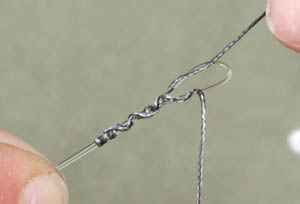 Step 4 - Leave two inches off braid above the hook and connect it to Subterfuge Stiff via an allbright knot.