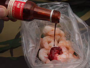 Step 2 - Place the prawns in a air tight bag and add a small amount of chosen food colouring.