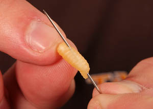Using a sewing needle pierce the rubber grub (orientation as shown) and carefully thread it onto your hooklink.