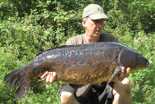 It was probably one of the best looking carp I’d ever caught, jet black with petal scales and tiny slits for eyes.