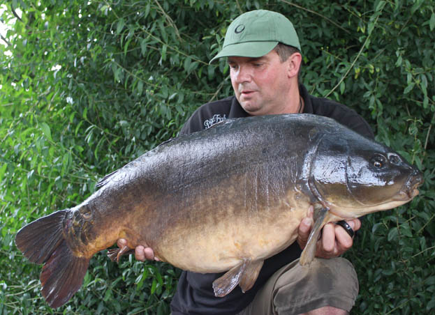 Nick cradles this awesome looking 30lb 10oz mirror.