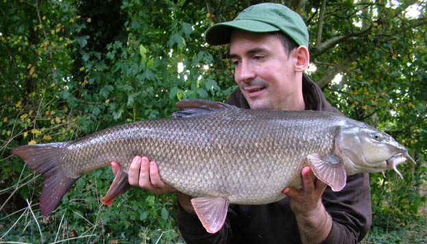 This 12lb 10oz barbel fell to a rig which incorporated a Covert Hook Aligner.