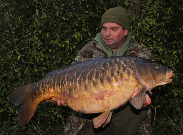 After a short but scrappy battle, a 28lb fully scaled mirror rolled into the net.