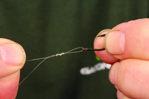 Step 7. Tie on your favoured hook; Chris has gone for a size 10 Barbless Incizor and uses a reliable 4 turn grinner.