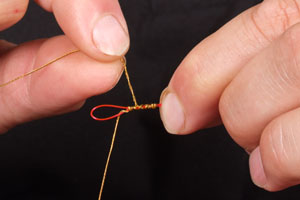 Step 5. Next, do a further 4 wraps back down the knot (towards the loop).