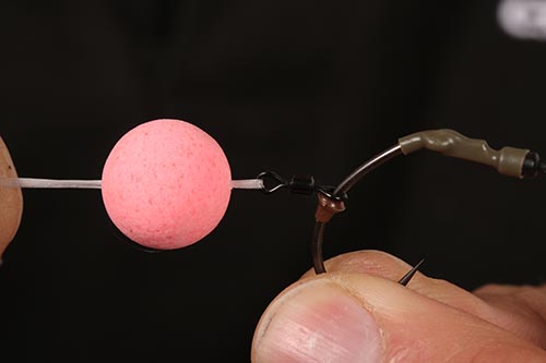 Step 11. For easy bait mounting loop some floss through the swivel and pull through a pop up.