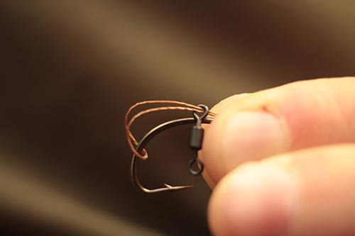 Step 3. Pass the loop carefully over the point of the hook (Multi Rig style).