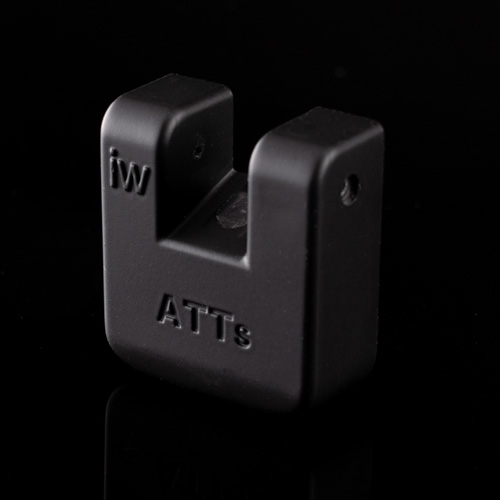 A small, black, U-shaped plastic ATTci Replacement Back Plate with "iw" on the left and "ATTs" on the front, shown against a black background.