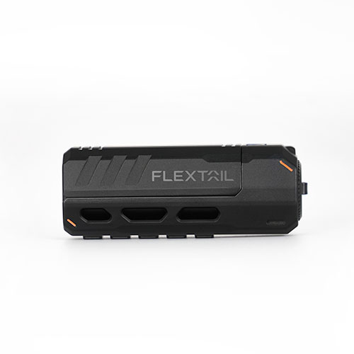 A compact, rectangular black device labelled Zero Torch with angular edges, orange accents, and vent-like cut-outs is set against a plain white background.